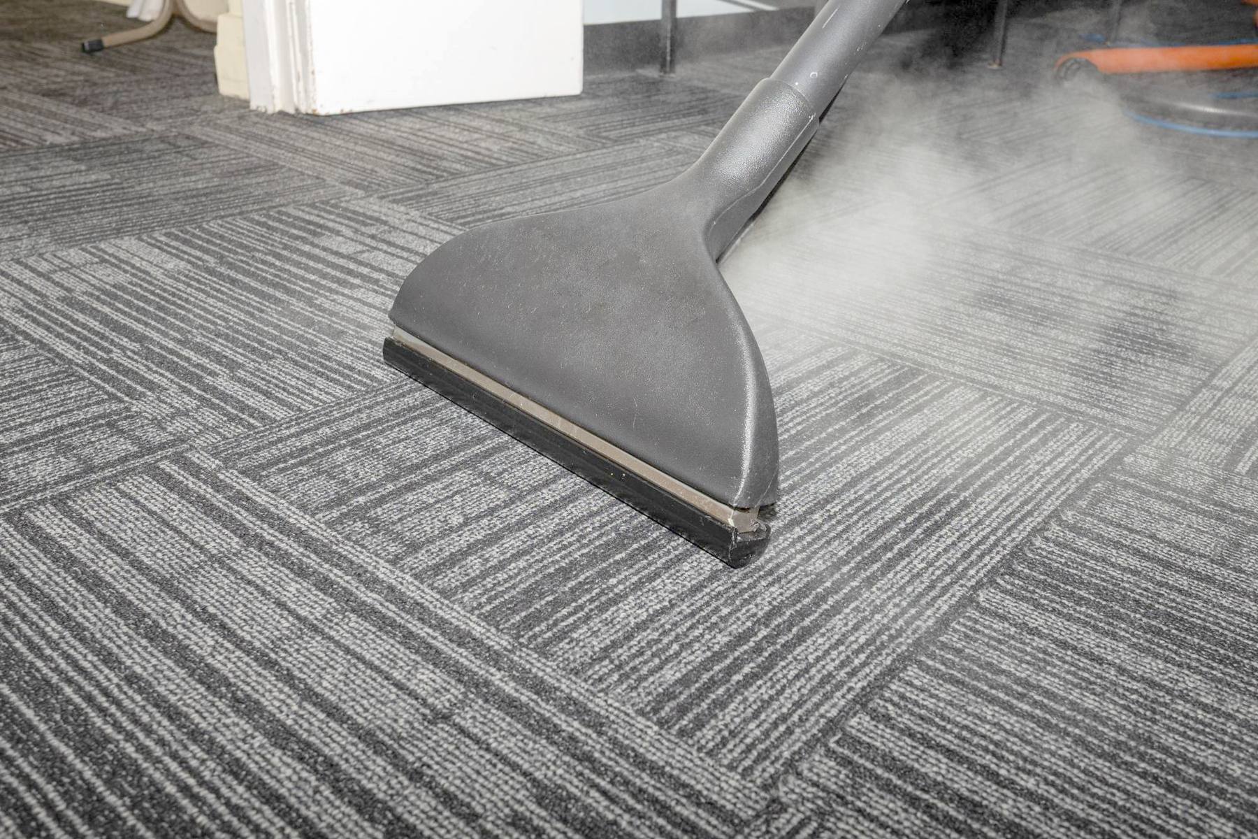 A carpet extraction wand deep cleaning commercial carpet tile